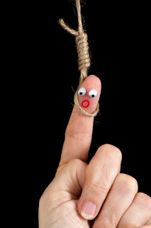 Caricature made of a finger puppet representing death penalty or suicide