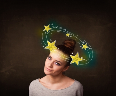 girl with yellow stars circleing around her head illustration