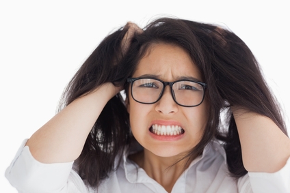 Worried woman putting her hand on the head in the white background