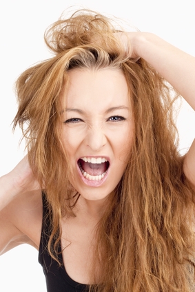 Frustrated Girl with Long Brown Hair Screaming - Isolated on Gray